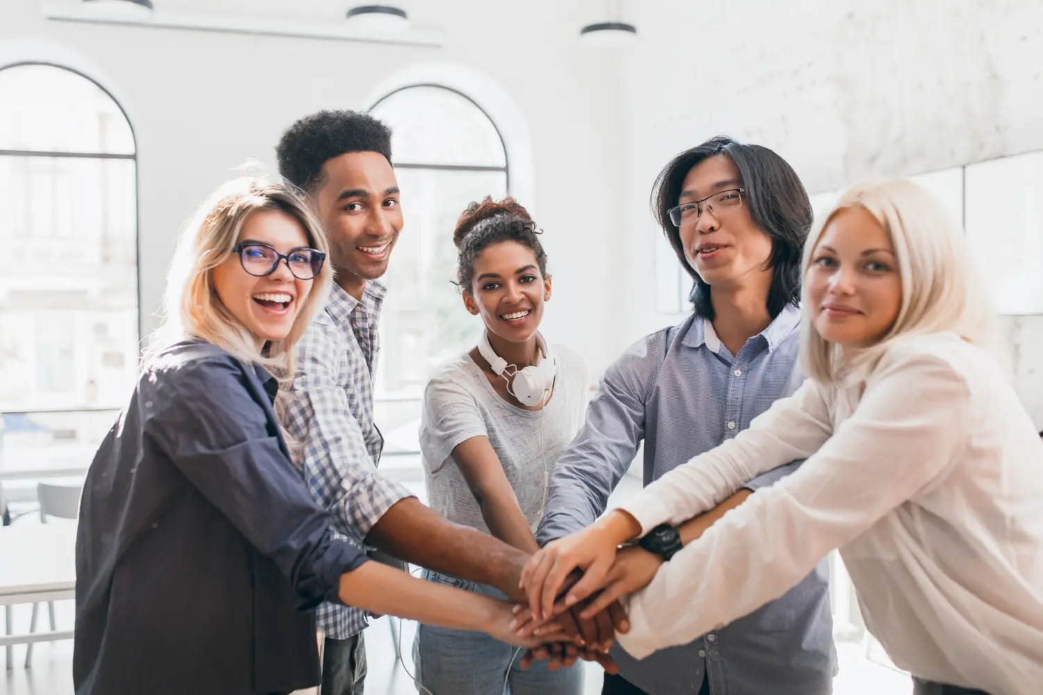 multiple people holding hands